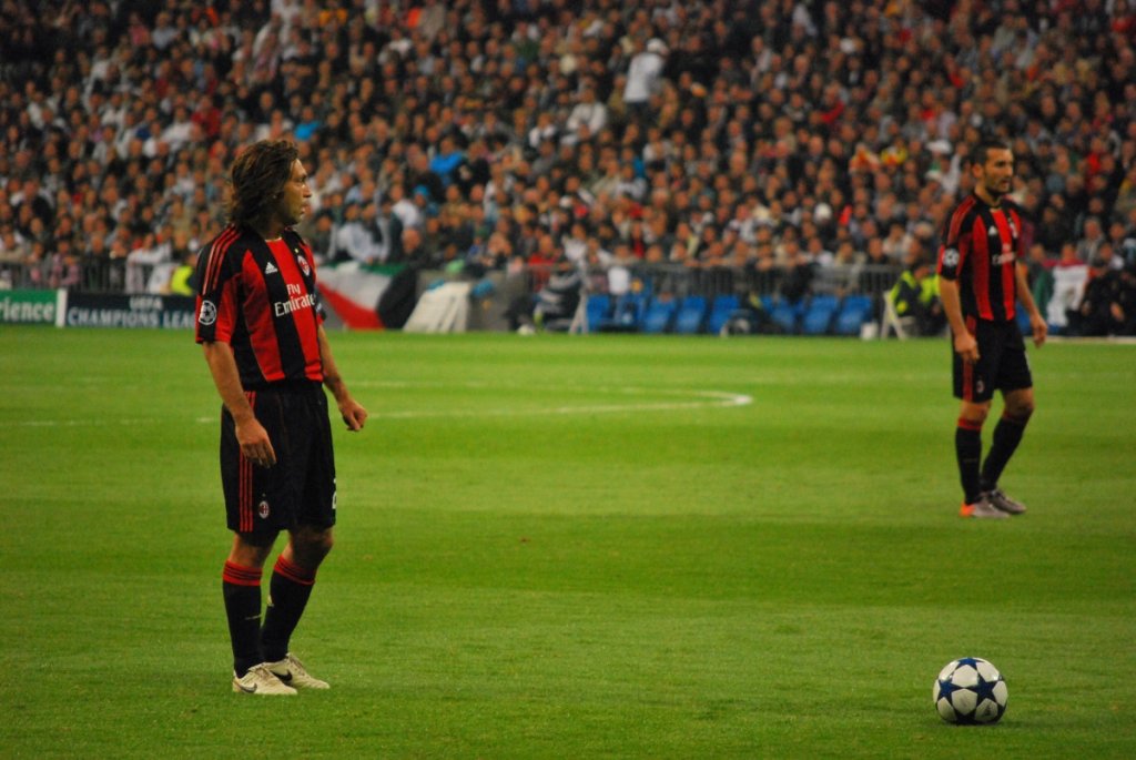 Pirlo (left), with Milan, preparing to take a free kick against Real Madrid in the 2010–11 UEFA Champions League. &copy Jan S0L0